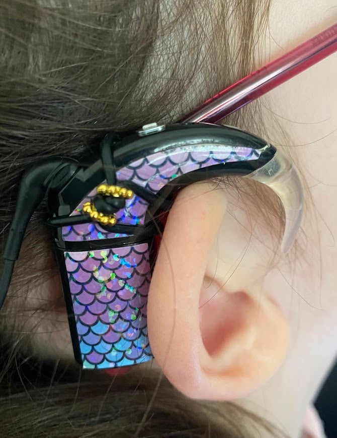 Support implant cochleaire pour lunettes