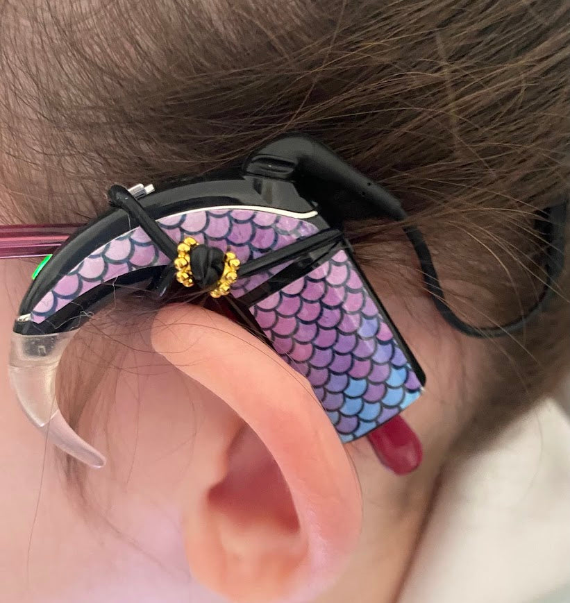 Support implant cochleaire pour lunettes