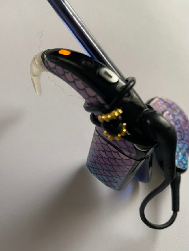 Support implant cochleaire pour lunettes