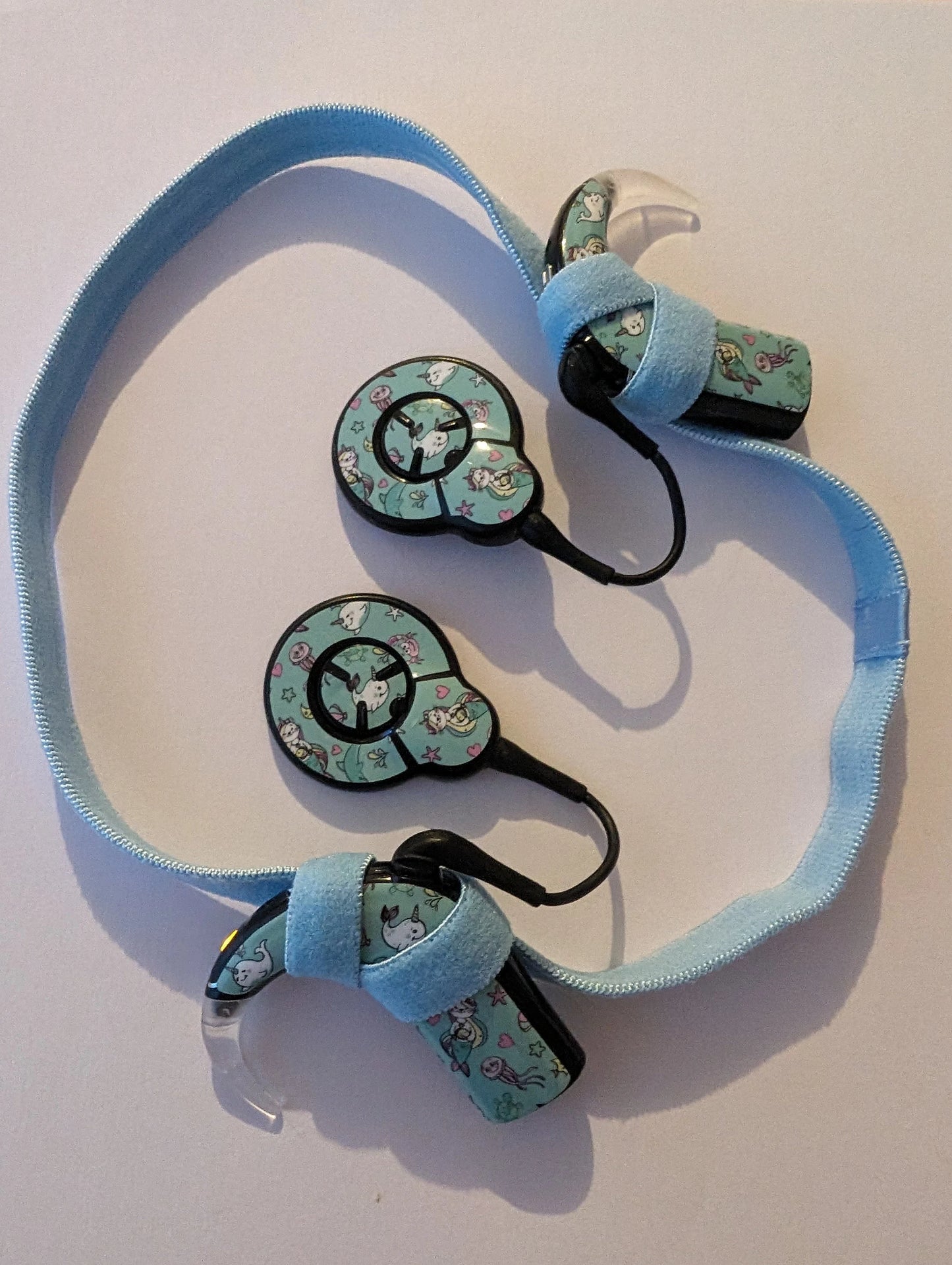 Bandeau sport antidérapant pour implant cochleaire et prothese auditive