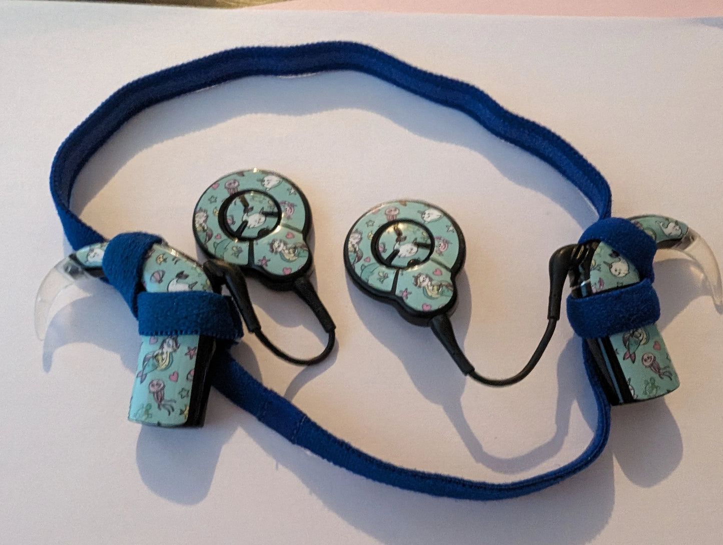 Bandeau sport antidérapant pour implant cochleaire et prothese auditive