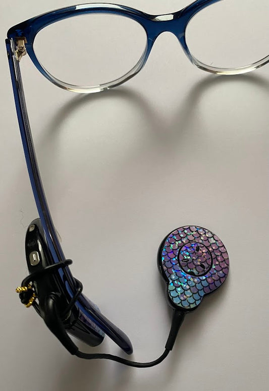 Support implant cochleaire pour lunettes